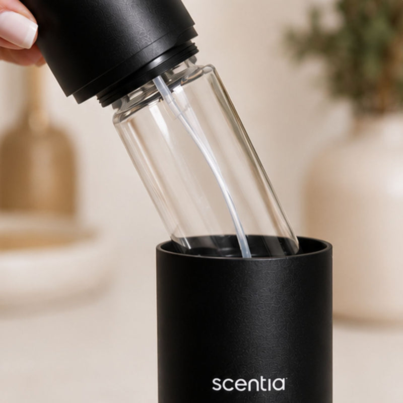 Step 1 — Insert the Bottle

Place the fragrance...