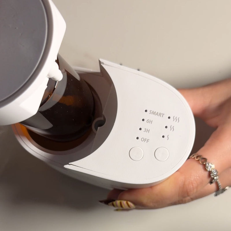 Step 1 — Insert the Oil Bottle

Lift the diffus...